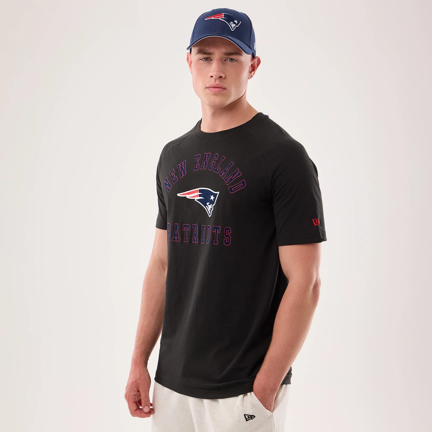 The model is wearing this NFL Sideline 2026 New England Patriots T-Shirt in black. 1