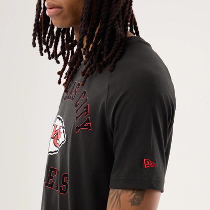 The model is wearing this NFL Sideline 2026 Kansas City Chiefs T-Shirt in black. 5