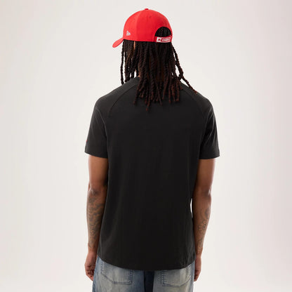 The model is wearing this NFL Sideline 2026 Kansas City Chiefs T-Shirt in black. 2