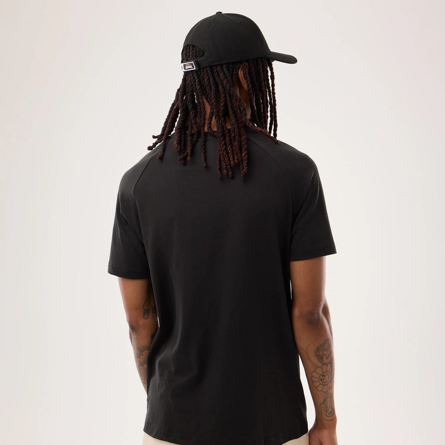 The model is wearing this NFL Sideline 2026 Jacksonville Jaguars T-Shirt in black. 2