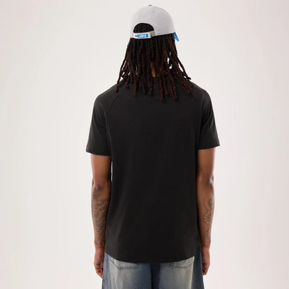 The model is wearing this NFL Sideline 2026 Detroit Lions T-Shirt in black. 2