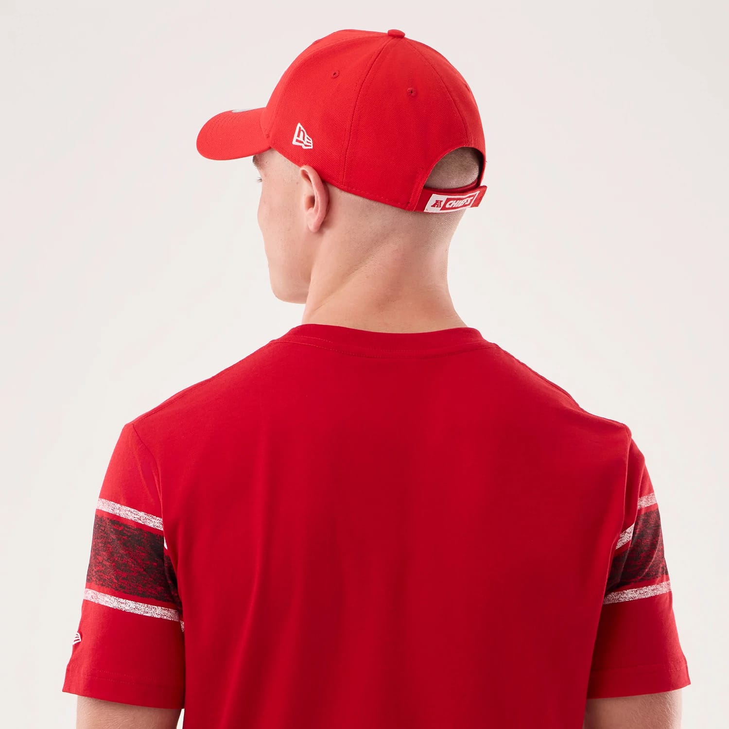 The model is wearing this NFL Sideline 2026 Kansas City Chiefs T-Shirt in red. 6
