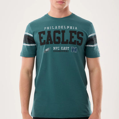 The model is wearing this NFL Sideline 2026 Philadelphia Eagles T-Shirt in dark green. 3