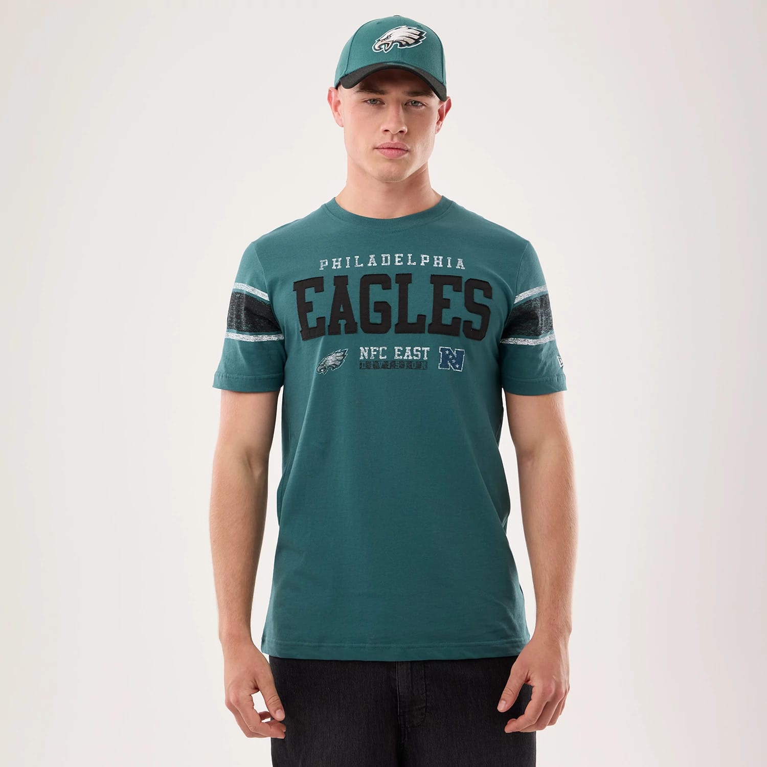 The model is wearing this NFL Sideline 2026 Philadelphia Eagles T-Shirt in dark green. 1