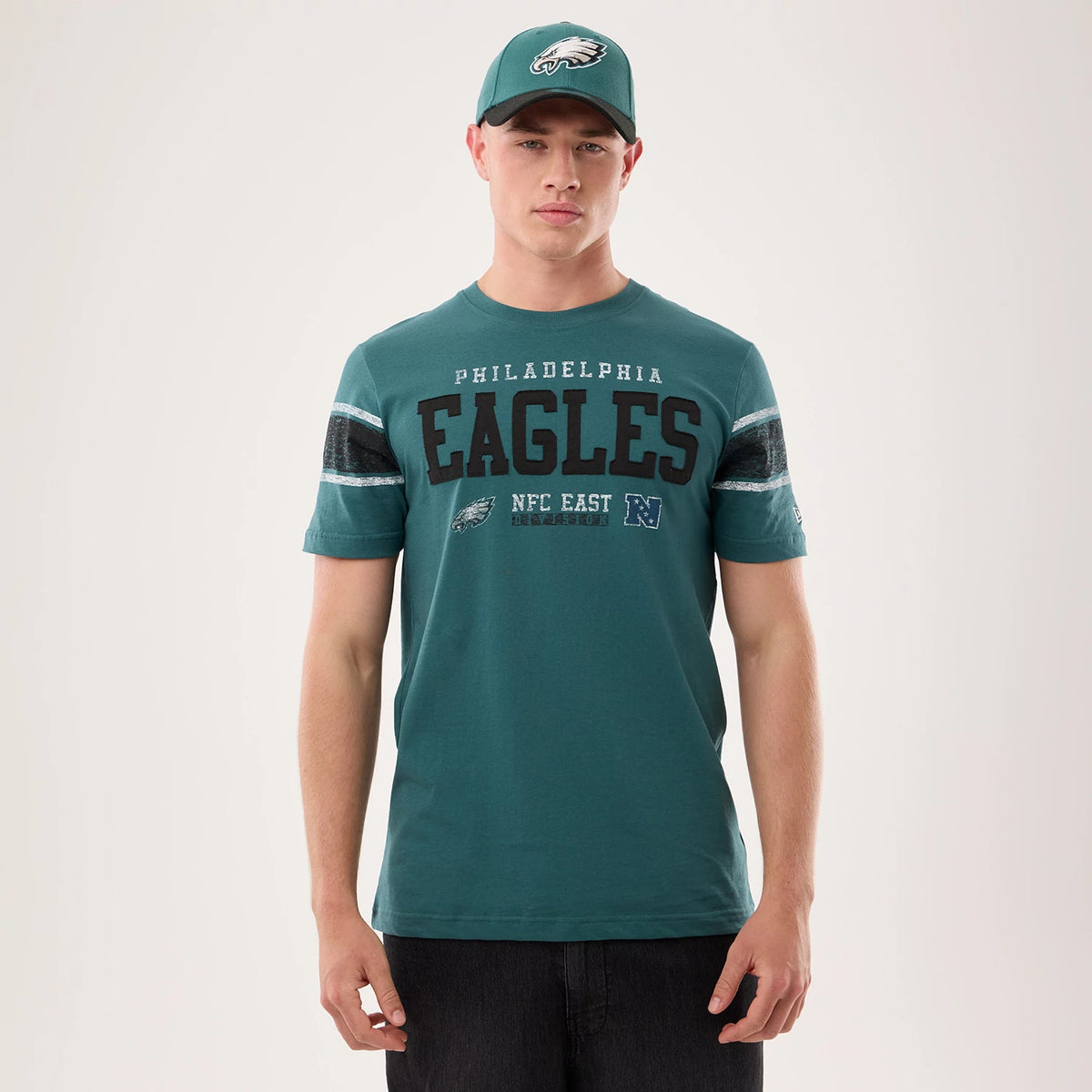 The model is wearing this NFL Sideline 2026 Philadelphia Eagles T-Shirt in dark green. 1