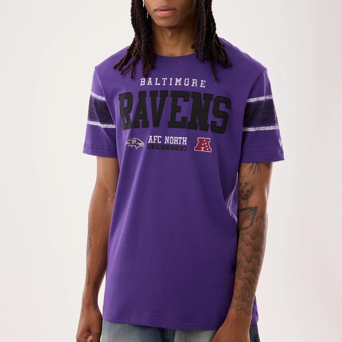 The model is wearing this NFL Sideline 2026 Baltimore Ravens T-Shirt in purple. 3