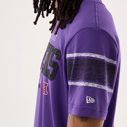 The model is wearing this NFL Sideline 2026 Baltimore Ravens T-Shirt in purple. 5