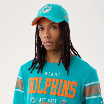 The model is wearing this NFL Sideline 2026 Miami Dolphins T-Shirt in turquoise. 6