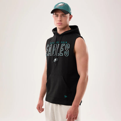 The model is wearing this NFL Sideline 2026 Philadelphia Eagles Tank Top in black. 1