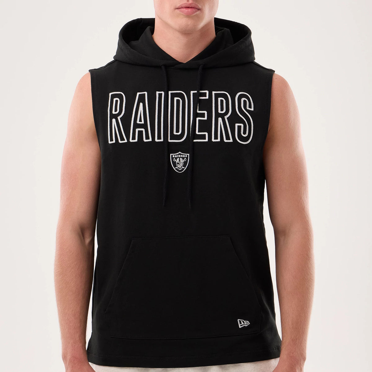 New Era Las Vegas Raiders NFL Sideline 2026 Black Tank Top, front view on a model with a sleeveless design, featuring large white 'RAIDERS' lettering across the chest, a central Raiders shield logo beneath, and a New Era flag logo on the lower left.