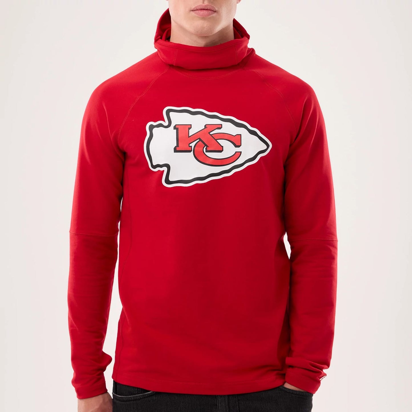 The model is wearing this NFL Sideline 2026 Kansas City Chiefs Balaclava Hoodie in red. 4
