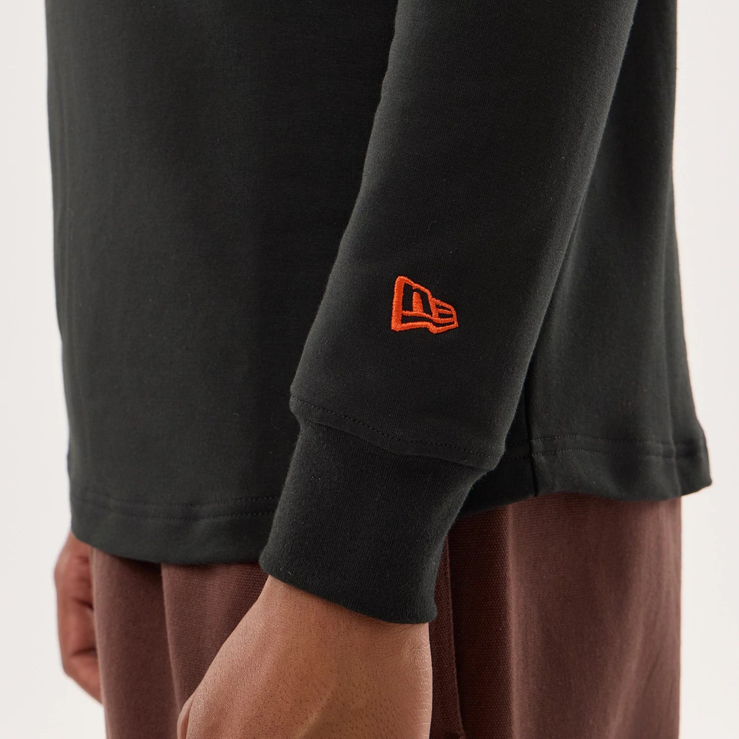 The model is wearing this NFL Sideline 2026 Chicago Bears Double Sleeve Hoodie in black. 4