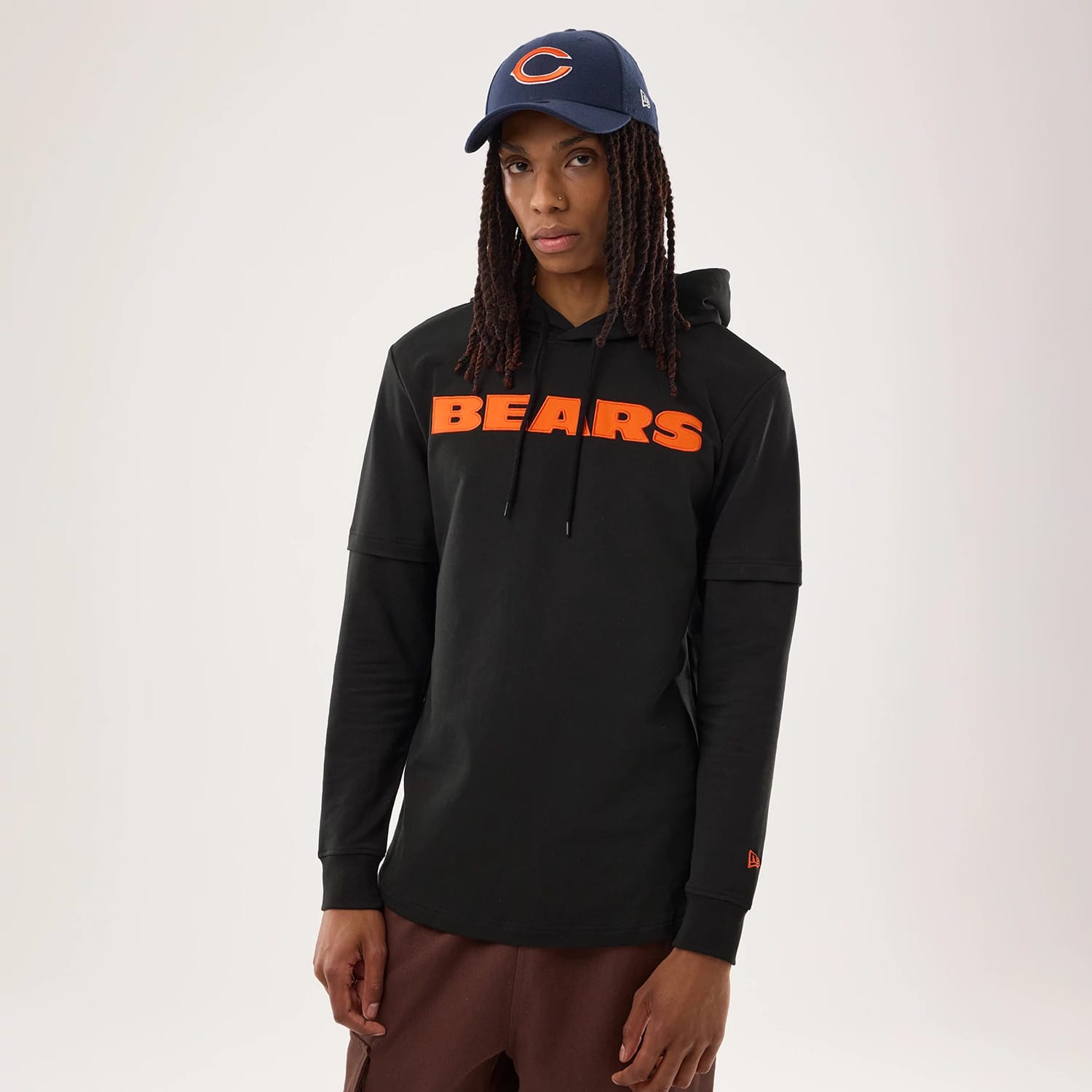 The model is wearing this NFL Sideline 2026 Chicago Bears Double Sleeve Hoodie in black. 1