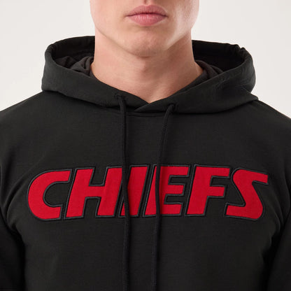The model is wearing this NFL Sideline 2026 Kansas City Chiefs Double Sleeve Hoodie in black. 4