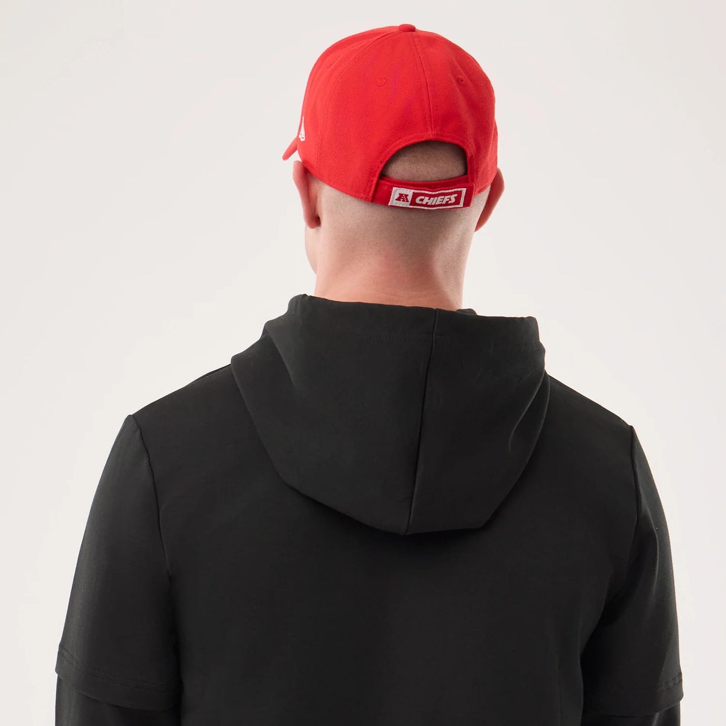 The model is wearing this NFL Sideline 2026 Kansas City Chiefs Double Sleeve Hoodie in black. 7