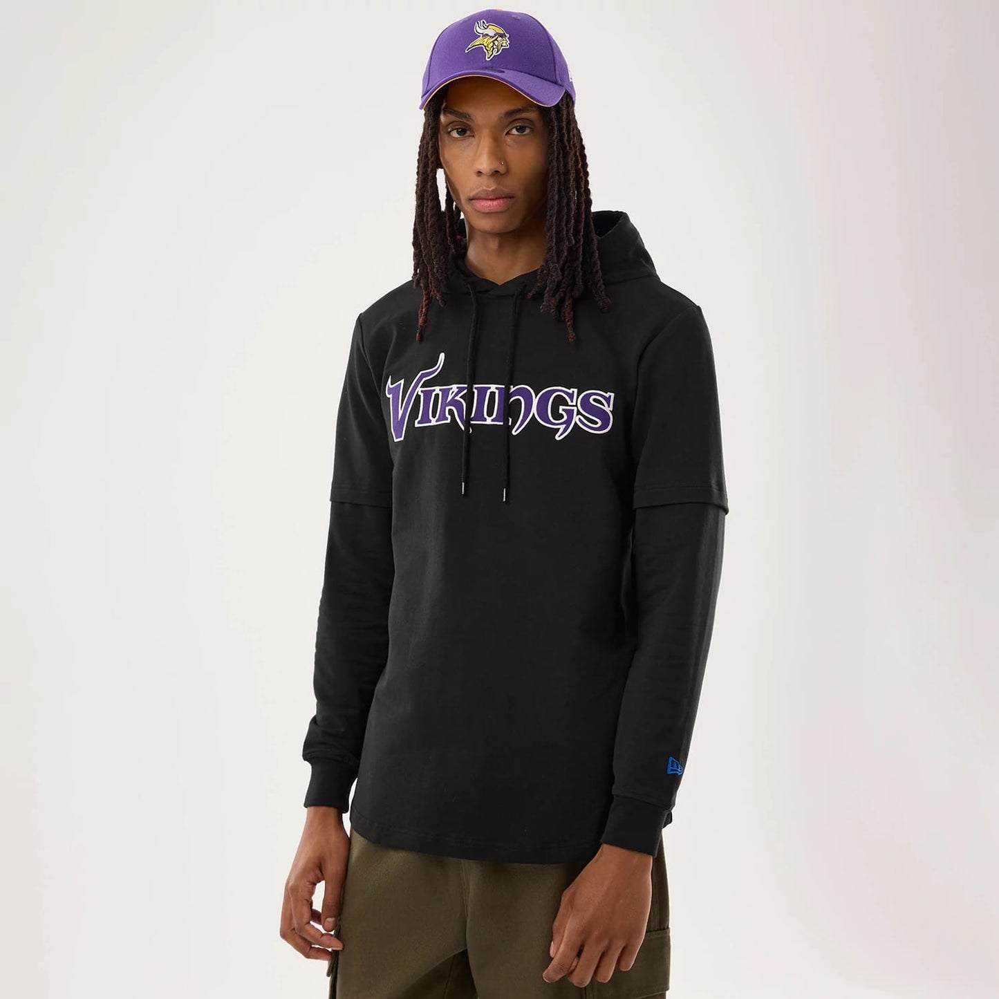 The model is wearing this NFL Sideline 2026 Minnesota Vikings Double Sleeve Hoodie in black. 1