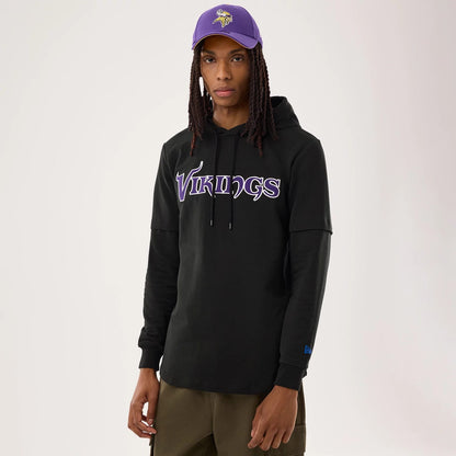 The model is wearing this NFL Sideline 2026 Minnesota Vikings Double Sleeve Hoodie in black. 1