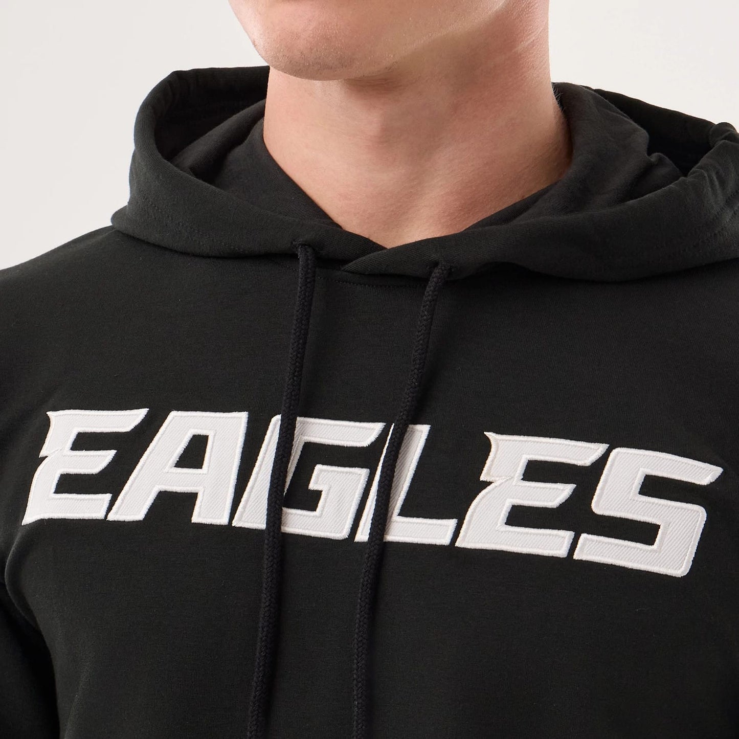 The model is wearing this NFL Sideline 2026 Philadelphia Eagles Double Sleeve Hoodie in black. 5