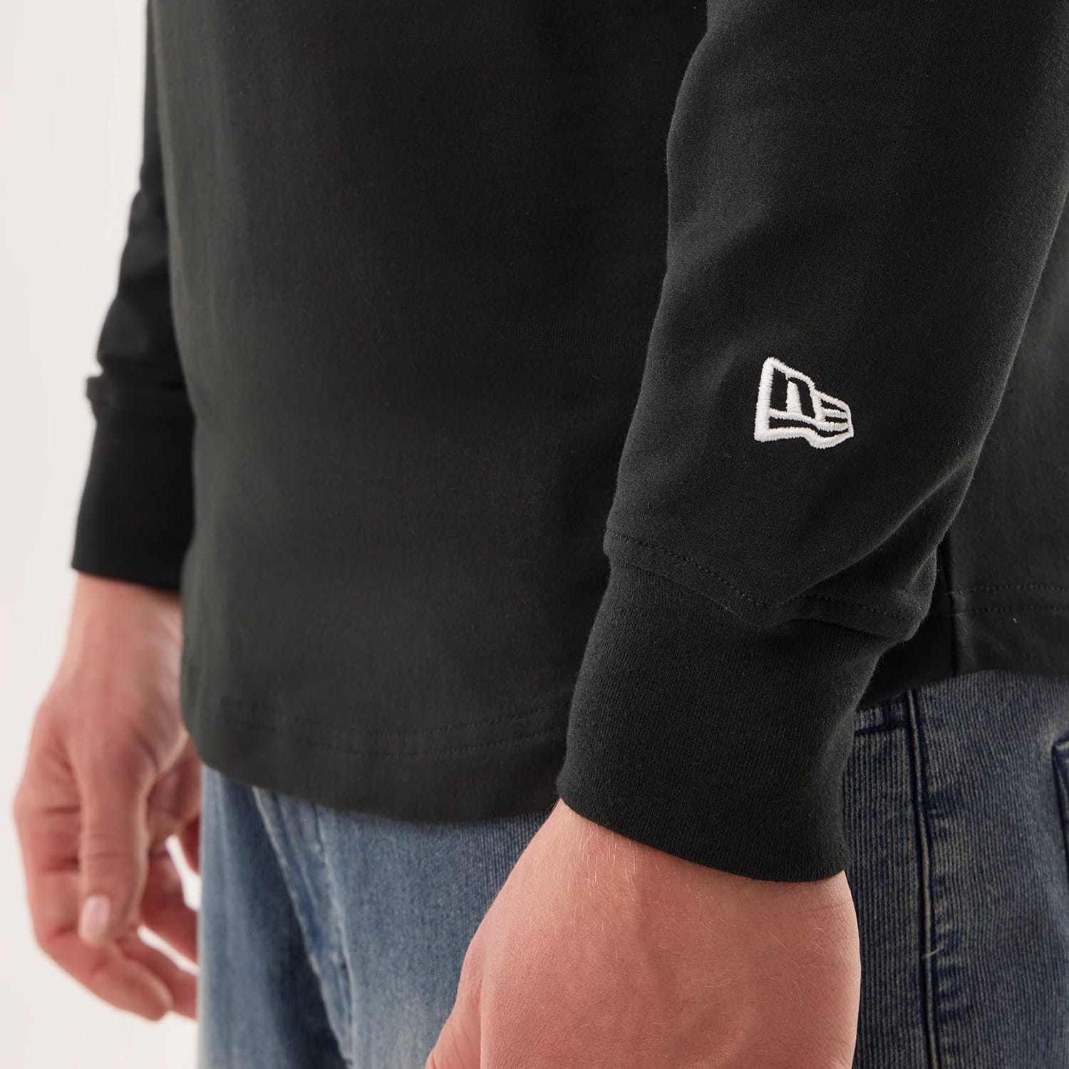 The model is wearing this NFL Sideline 2026 Philadelphia Eagles Double Sleeve Hoodie in black. 4