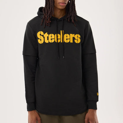 The model is wearing this NFL Sideline 2026 Pittsburgh Steelers Double Sleeve Hoodie in black. 3