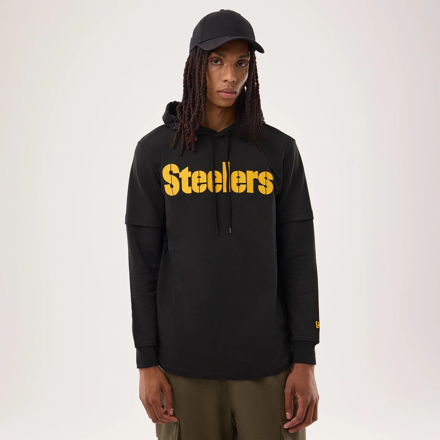 The model is wearing this NFL Sideline 2026 Pittsburgh Steelers Double Sleeve Hoodie in black. 1
