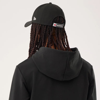The model is wearing this NFL Sideline 2026 Las Vegas Raiders Double Sleeve Hoodie in black. 7