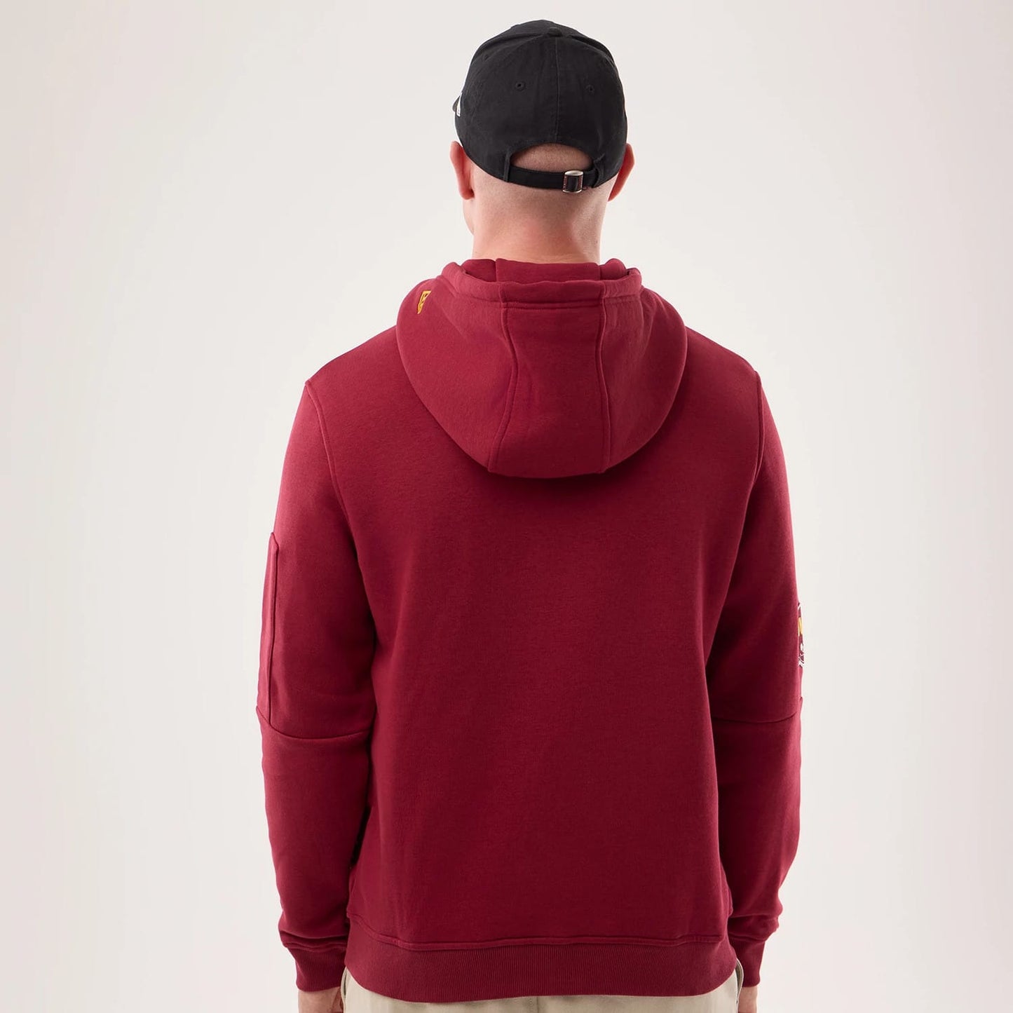 The model is wearing this NFL Sideline 2026 Washington Commanders Pullover Hoodie in dark red. 2