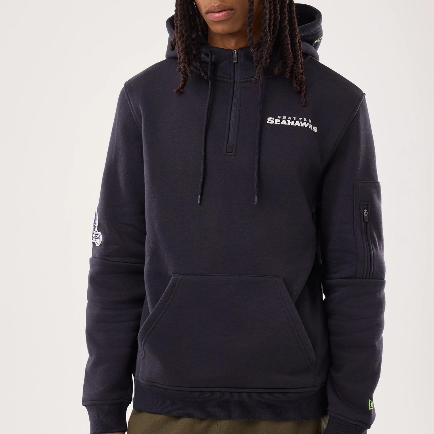 The model is wearing this NFL Sideline 2026 Seattle Seahawks Pullover Hoodie in navy. 3