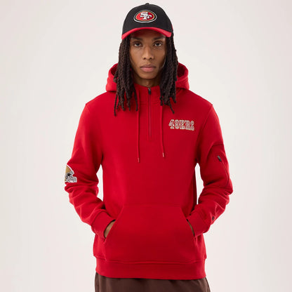 The model is wearing this NFL Sideline 2026 San Francisco 49ers Pullover Hoodie in red. 1