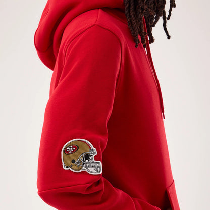 The model is wearing this NFL Sideline 2026 San Francisco 49ers Pullover Hoodie in red. 5