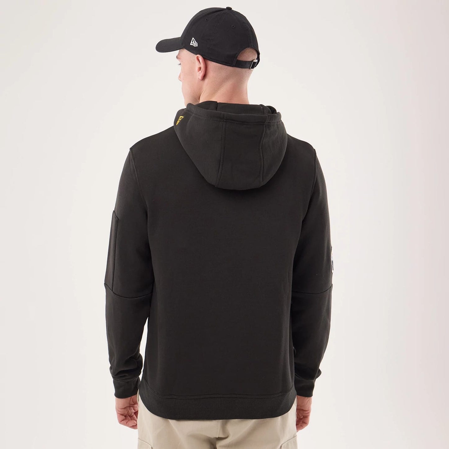 The model is wearing this NFL Sideline 2026 Pittsburgh Steelers Pullover Hoodie in black. 2