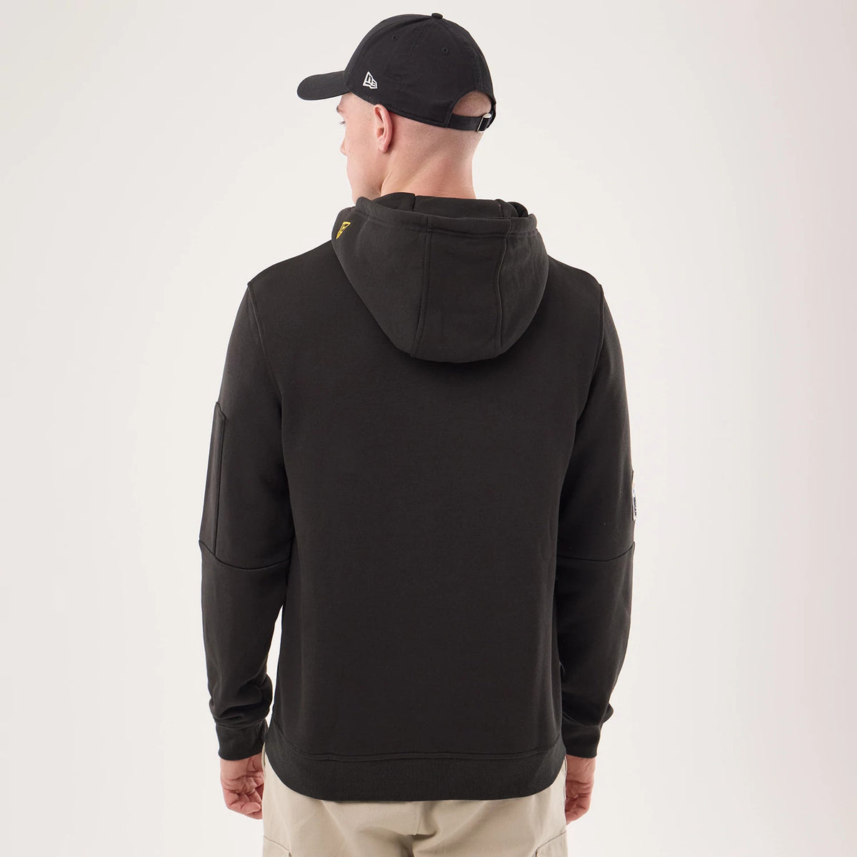 The model is wearing this NFL Sideline 2026 Pittsburgh Steelers Pullover Hoodie in black. 2