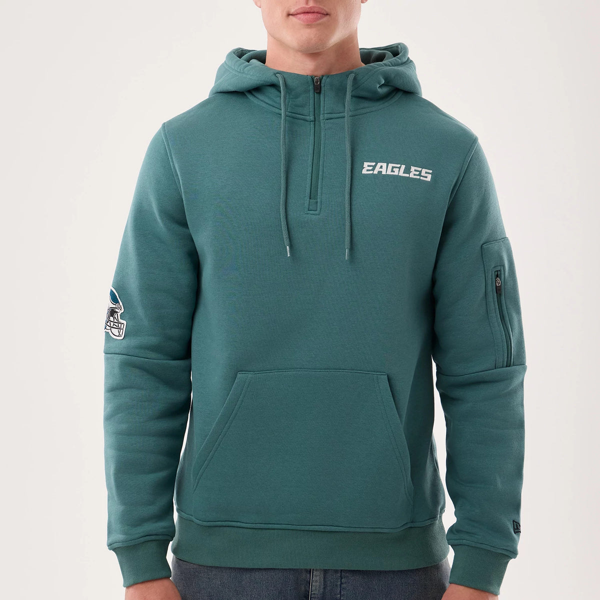 The model is wearing this NFL Sideline 2026 Philadelphia Eagles Pullover Hoodie in dark green. 3