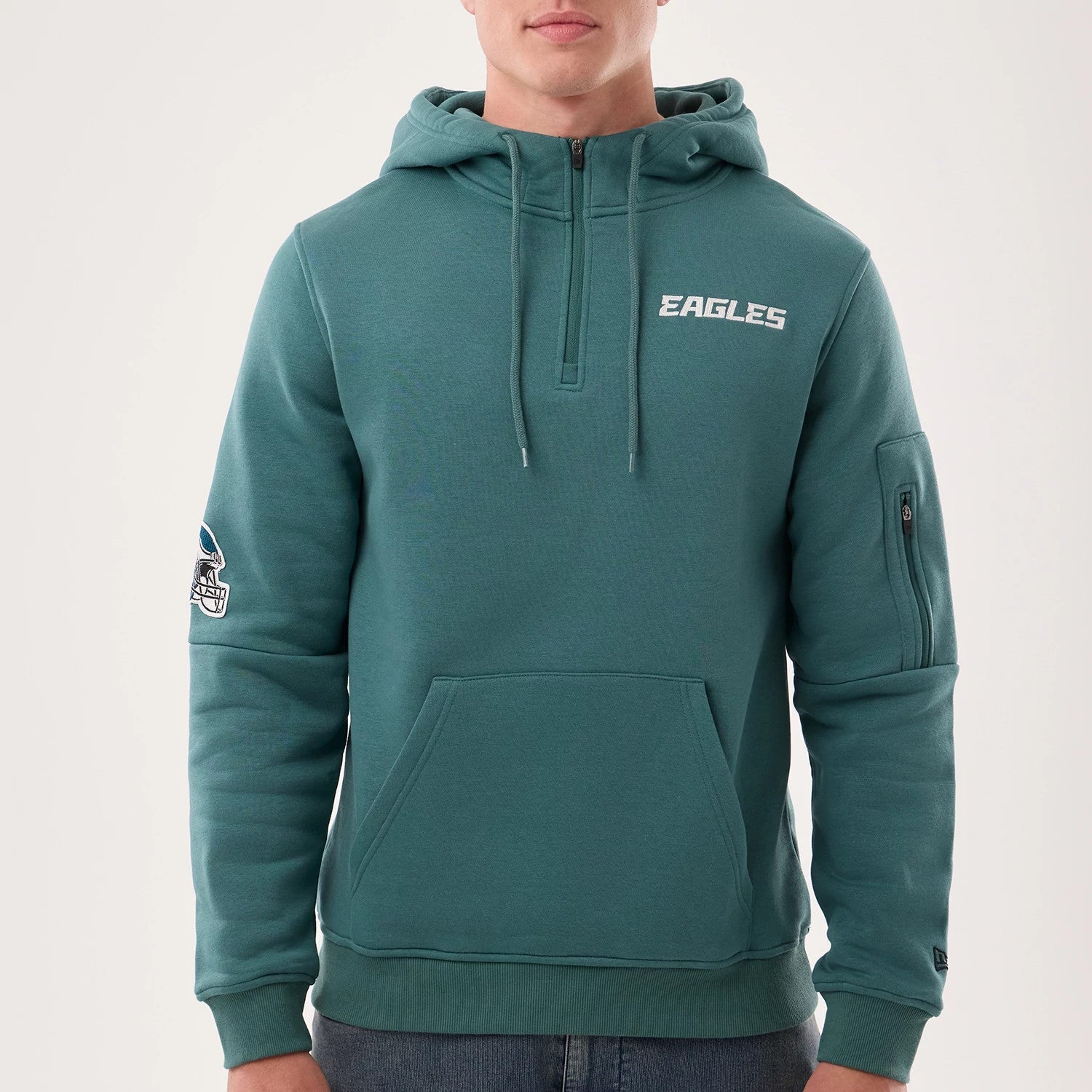 The model is wearing this NFL Sideline 2026 Philadelphia Eagles Pullover Hoodie in dark green. 3