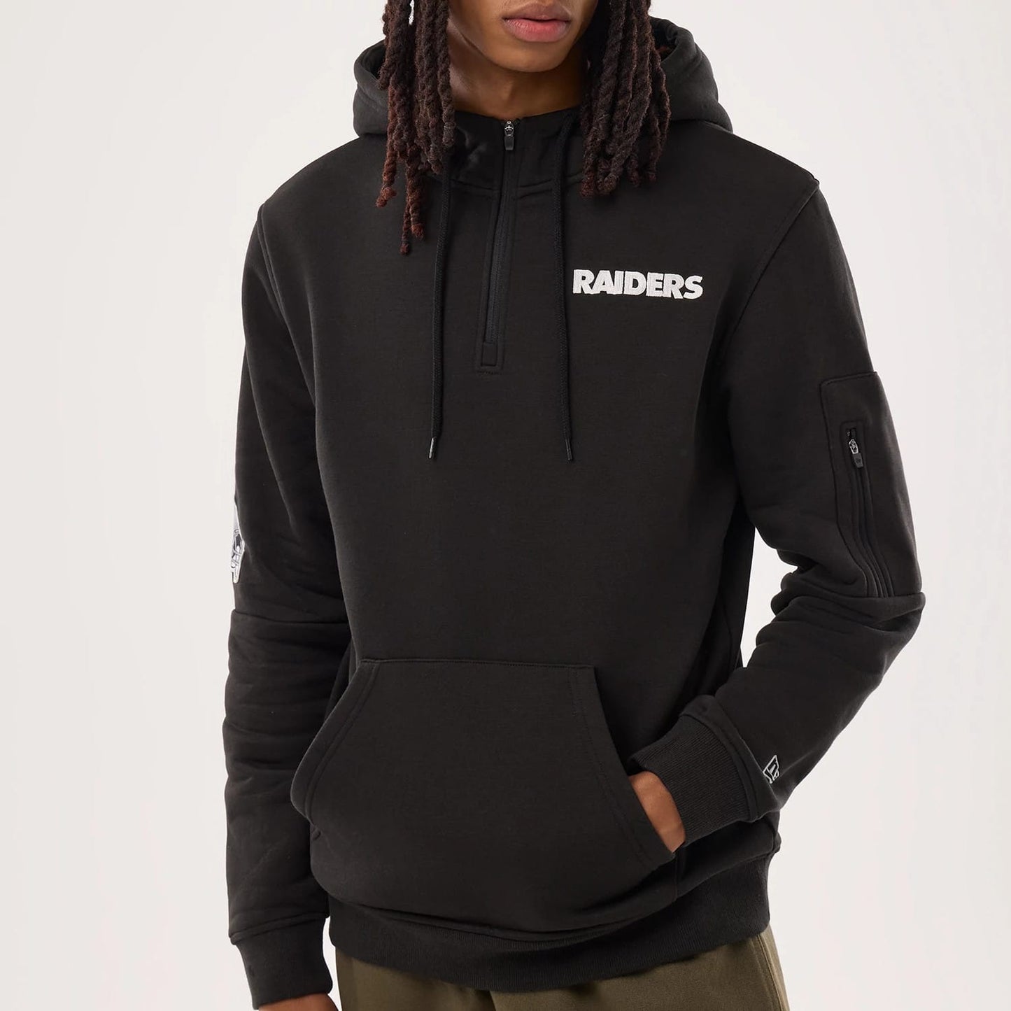 The model is wearing this NFL Sideline 2026 Las Vegas Raiders Pullover Hoodie in black. 3
