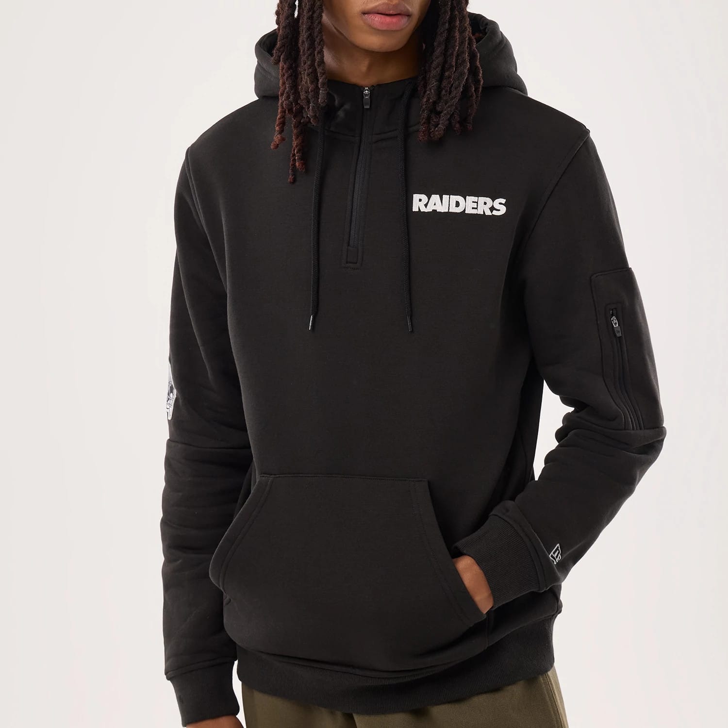 The model is wearing this NFL Sideline 2026 Las Vegas Raiders Pullover Hoodie in black. 3