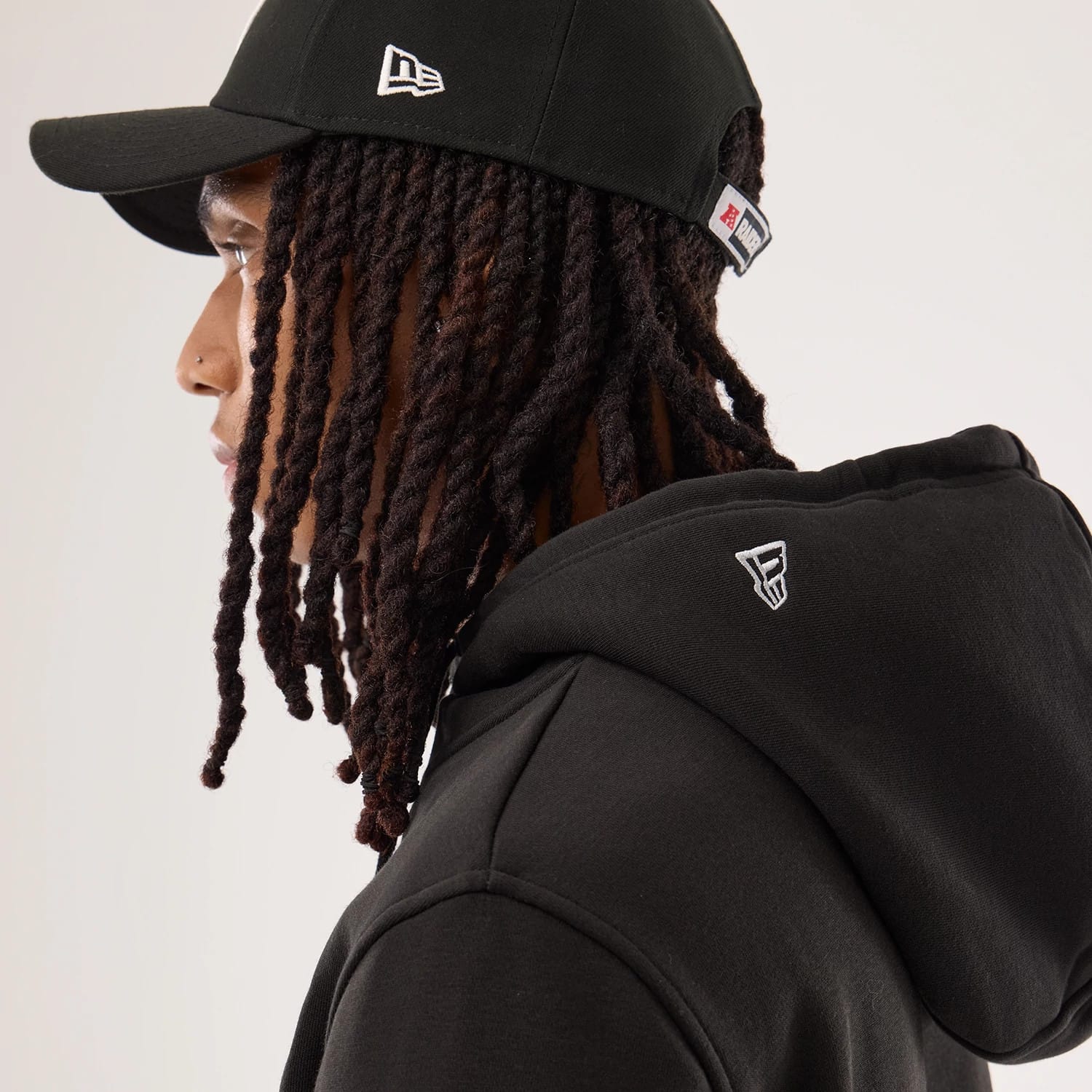 The model is wearing this NFL Sideline 2026 Las Vegas Raiders Pullover Hoodie in black. 7