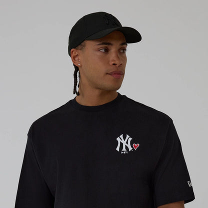 The model is wearing this MLB Heart Graphic New York Yankees T-Shirt in black. 6