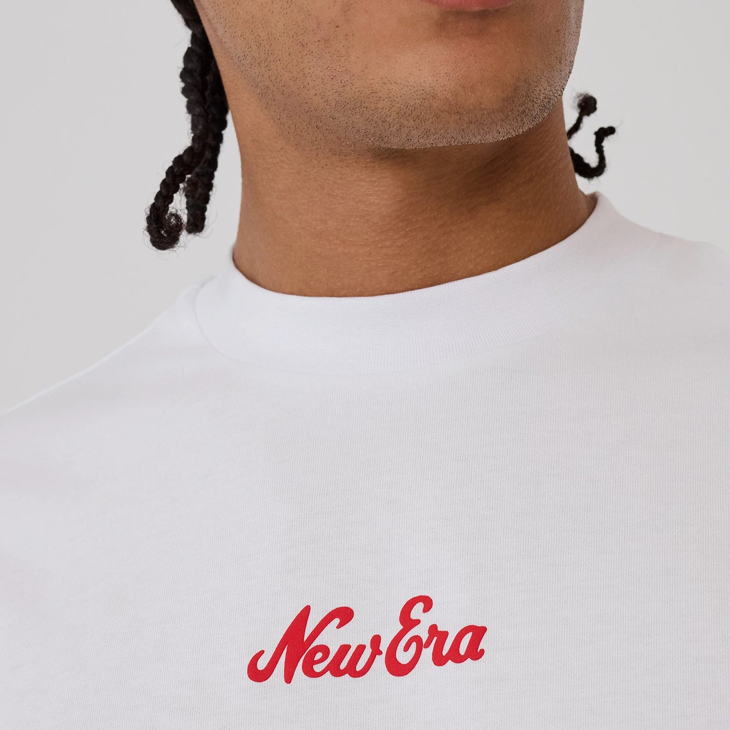 The model is wearing this New Era Love Graphic T-Shirt in white. 4