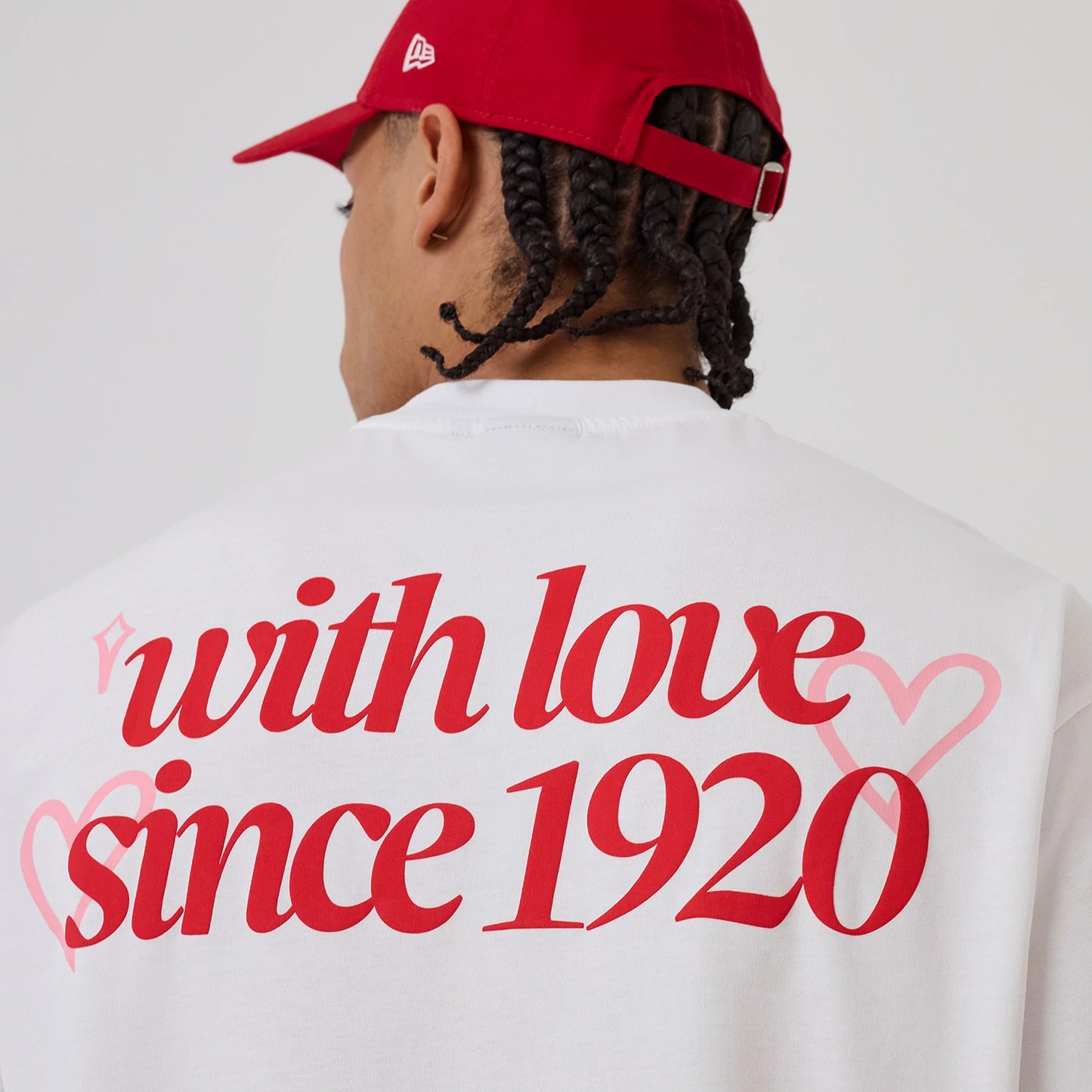 The model is wearing this New Era Love Graphic T-Shirt in white. 3