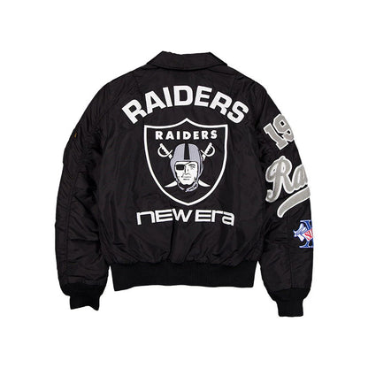 The model is wearing this NFL X Alpha Las Vegas Raiders Jacket in assorted print. 2