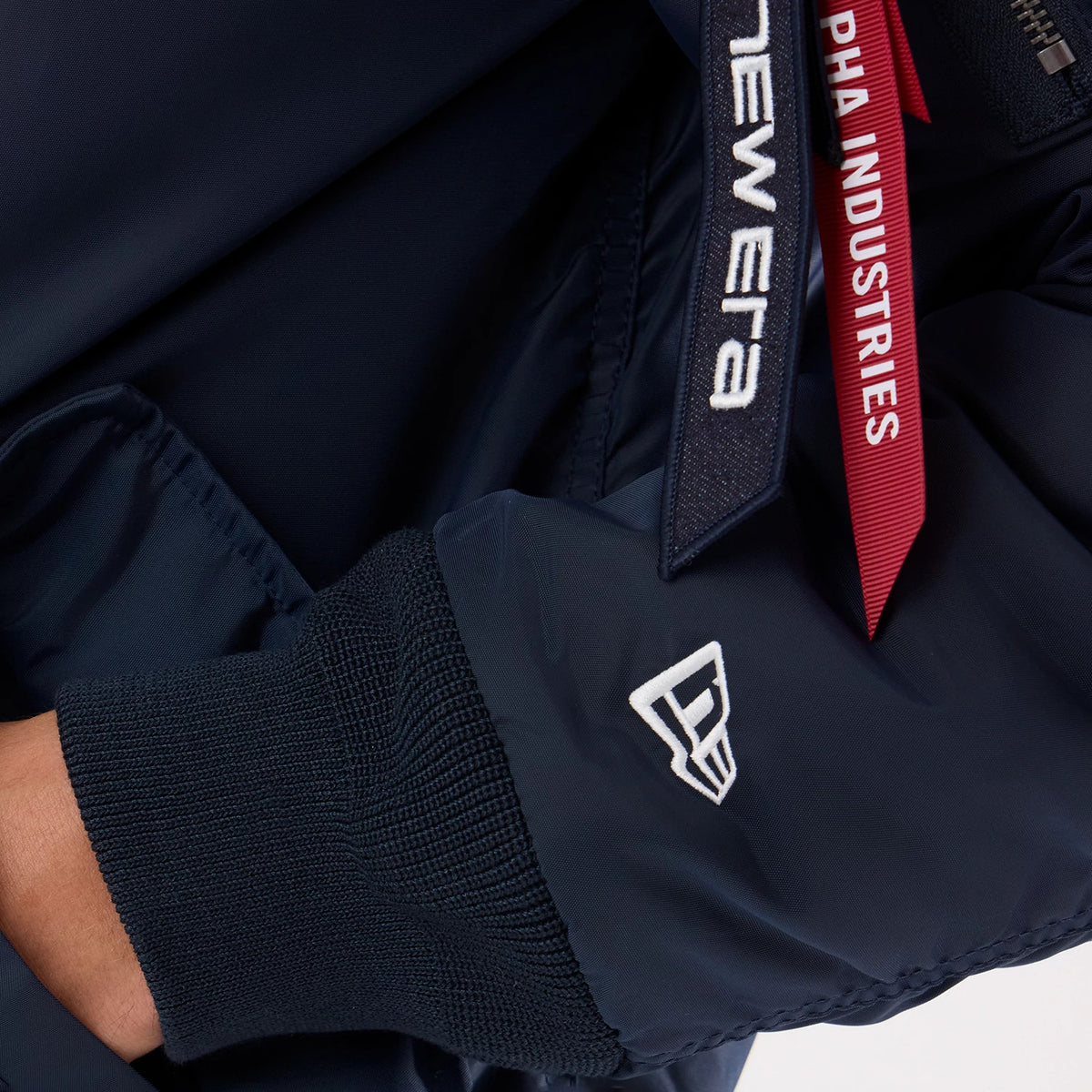 The model is wearing this MLB X Alpha New York Yankees Jacket in navy. 4