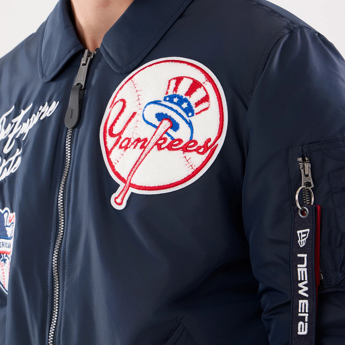 The model is wearing this MLB X Alpha New York Yankees Jacket in navy. 6