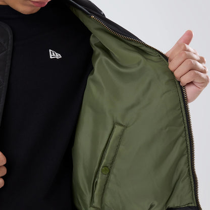 The model is wearing this NBA X Alpha Chicago Bulls Bomber Jacket & Tactical Vest in black. 6