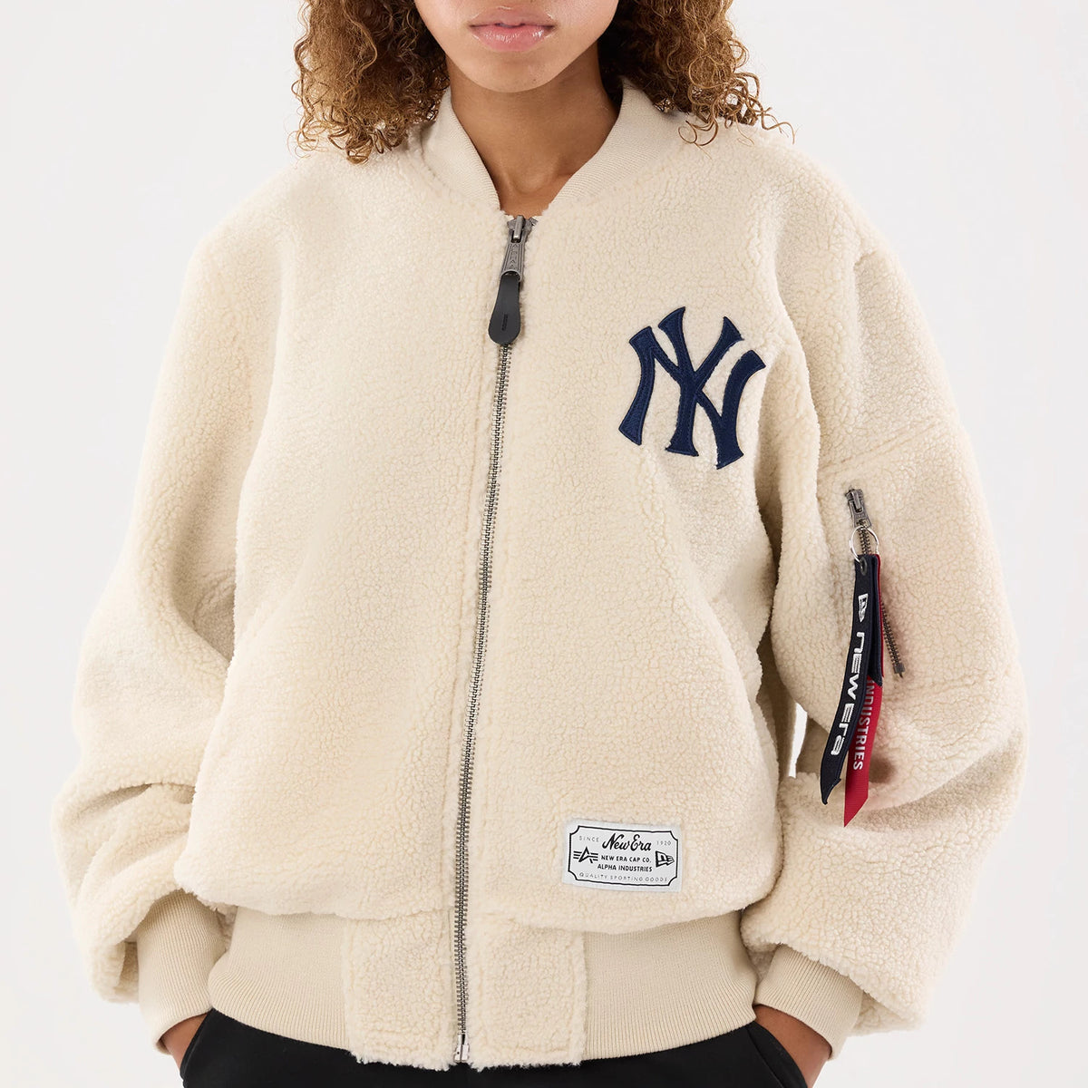 The model is wearing this MLB X Alpha New York Yankees Borg Jacket in cream. 5