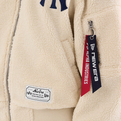 The model is wearing this MLB X Alpha New York Yankees Borg Jacket in cream. 3