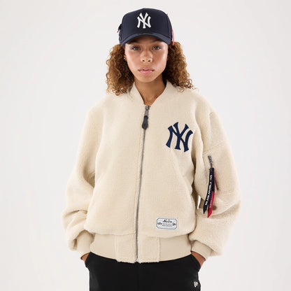 The model is wearing this MLB X Alpha New York Yankees Borg Jacket in cream. 1