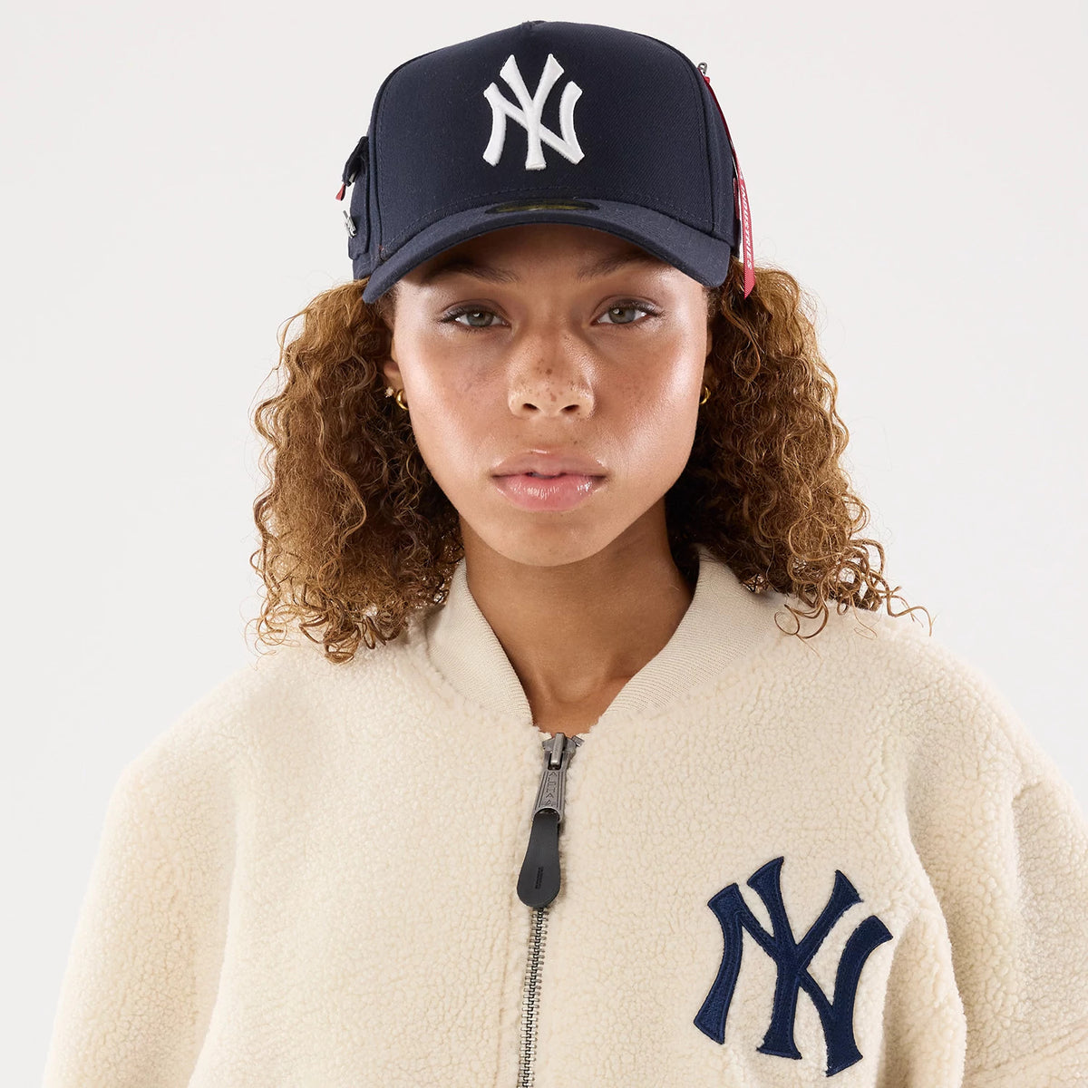 The model is wearing this MLB X Alpha New York Yankees Borg Jacket in cream. 7