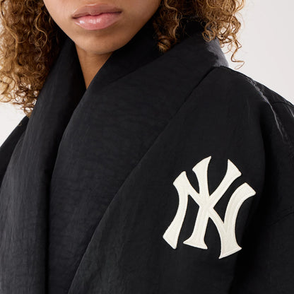 The model is wearing this MLB X Alpha New York Yankees Jacket in black. 7