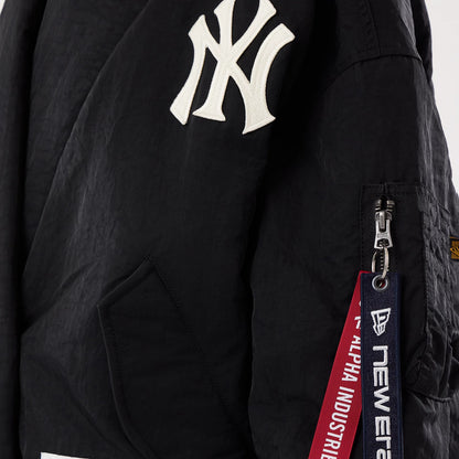 The model is wearing this MLB X Alpha New York Yankees Jacket in black. 6